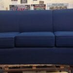 Deaf Enterprises blue sofa before